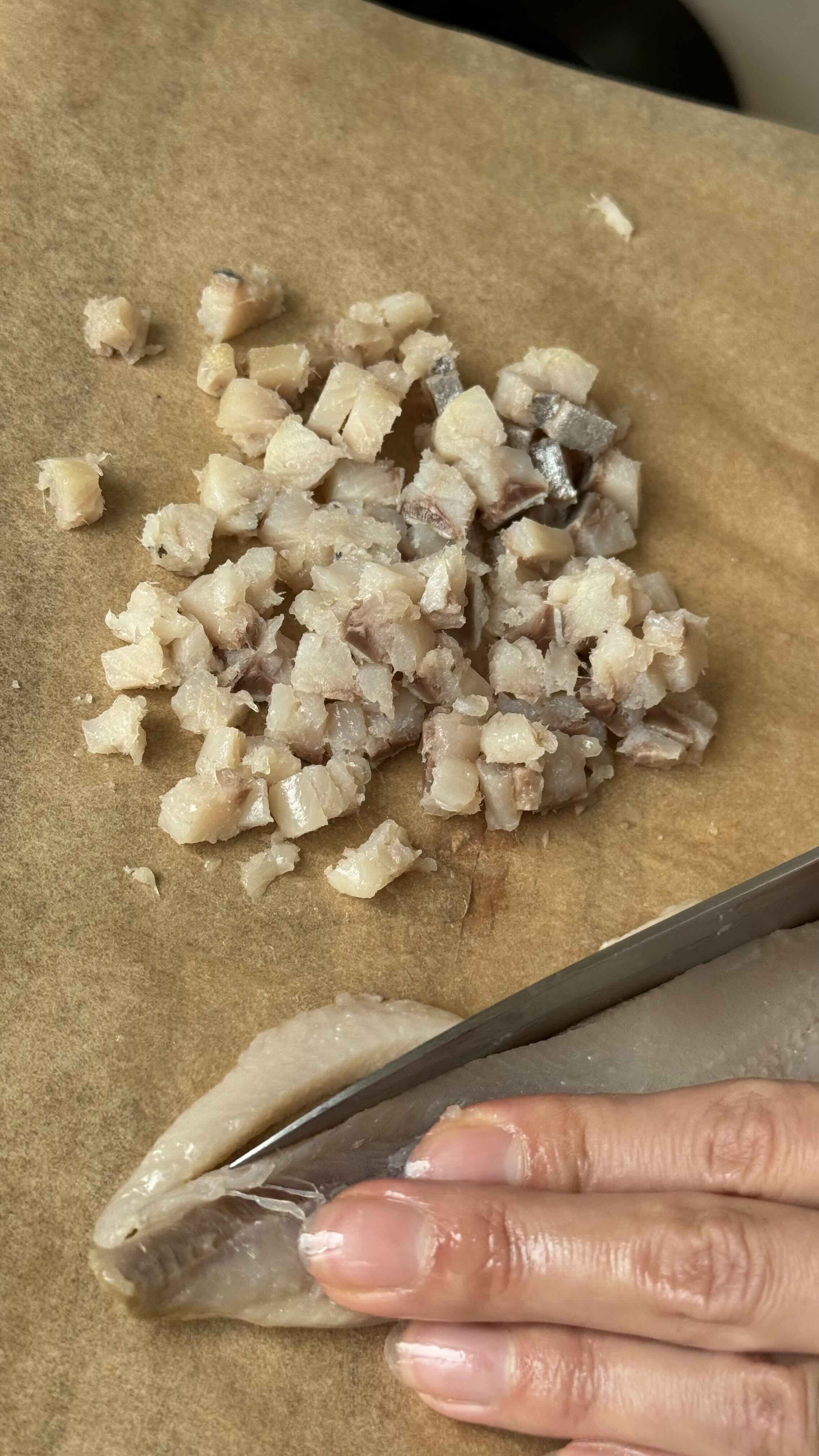 Herring diced into cubes.