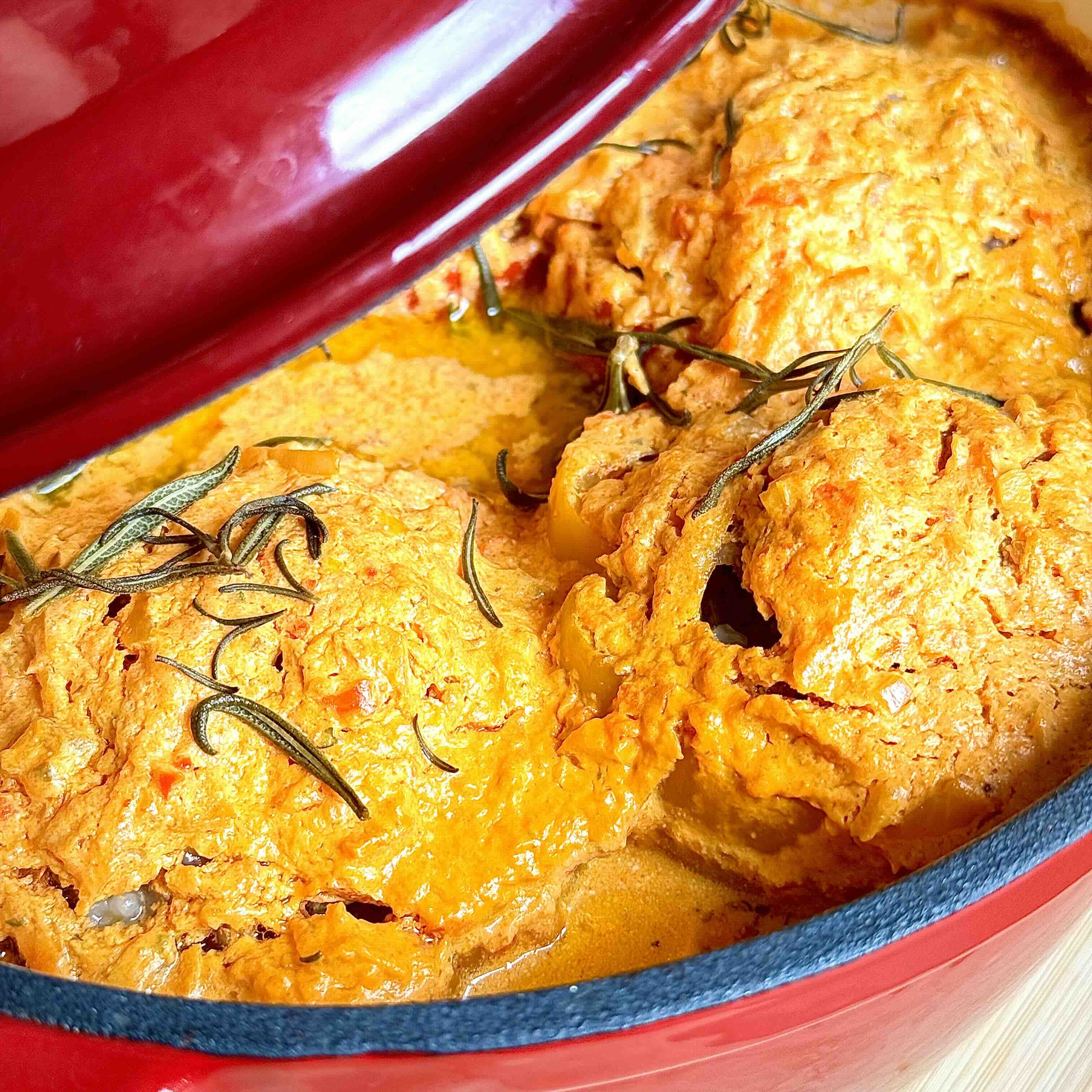 Baked Stuffed Bell Peppers with Meat and Rice in Creamy Tomato Sauce