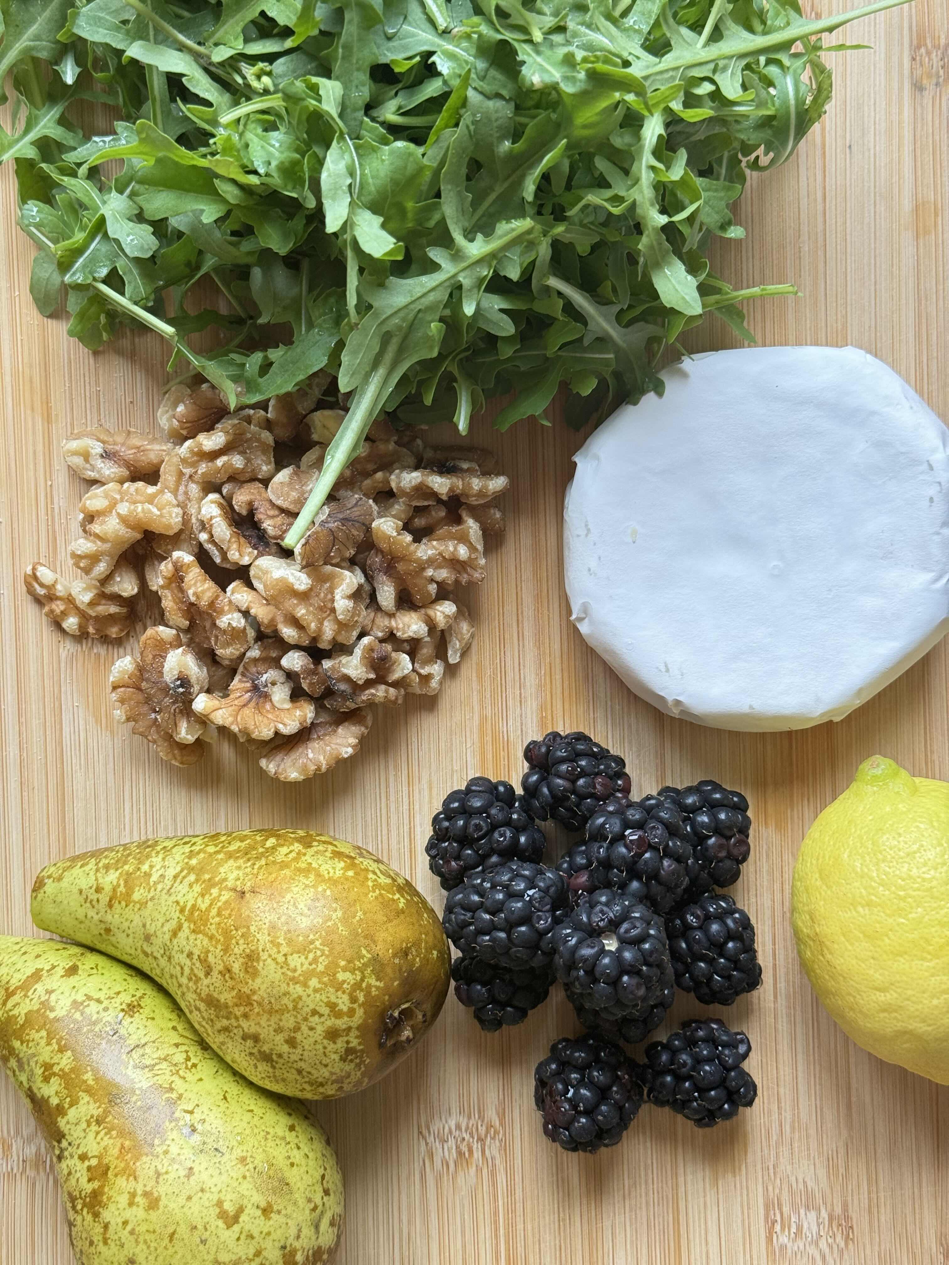 Warm Arugula Salad with Caramelized Pear, Melted Camembert, and Blackberries