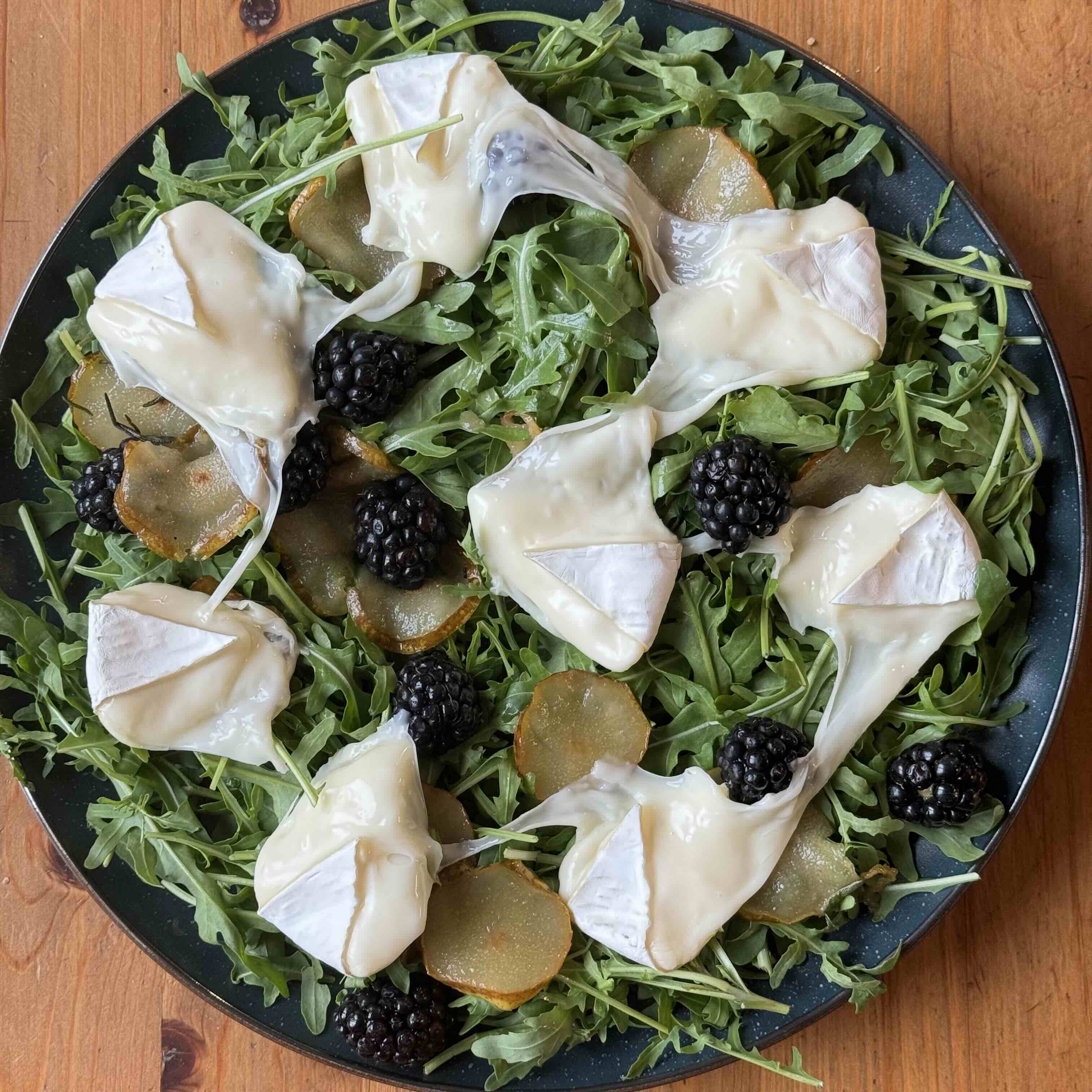 Arugula Salad with Caramelized Pear, Melted Camembert, and Blackberries