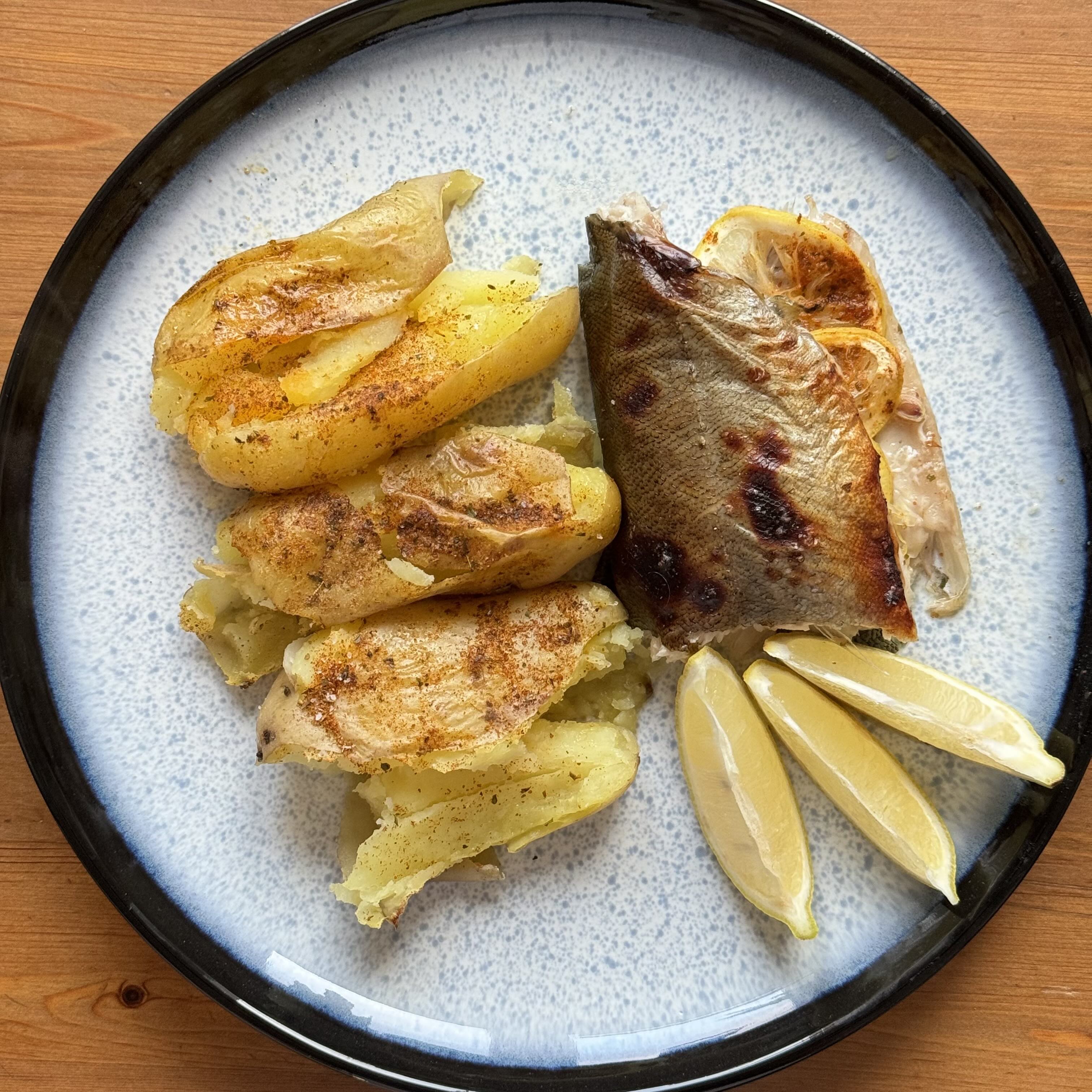 Baked trout with baked potato and lemon