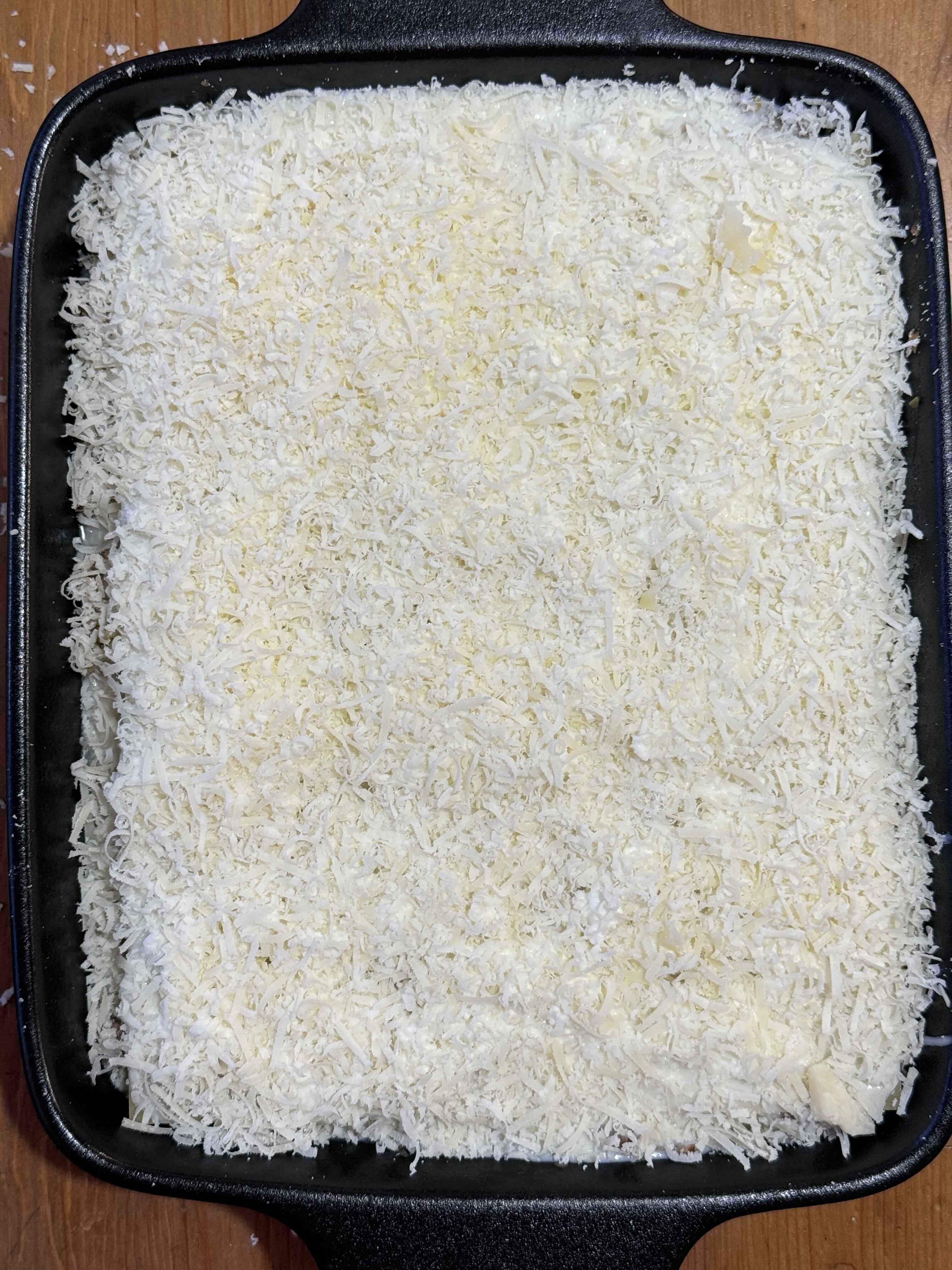 Hearty Homemade Lasagna with Ground Meat and Creamy Béchamel Sauce is ready for baking.