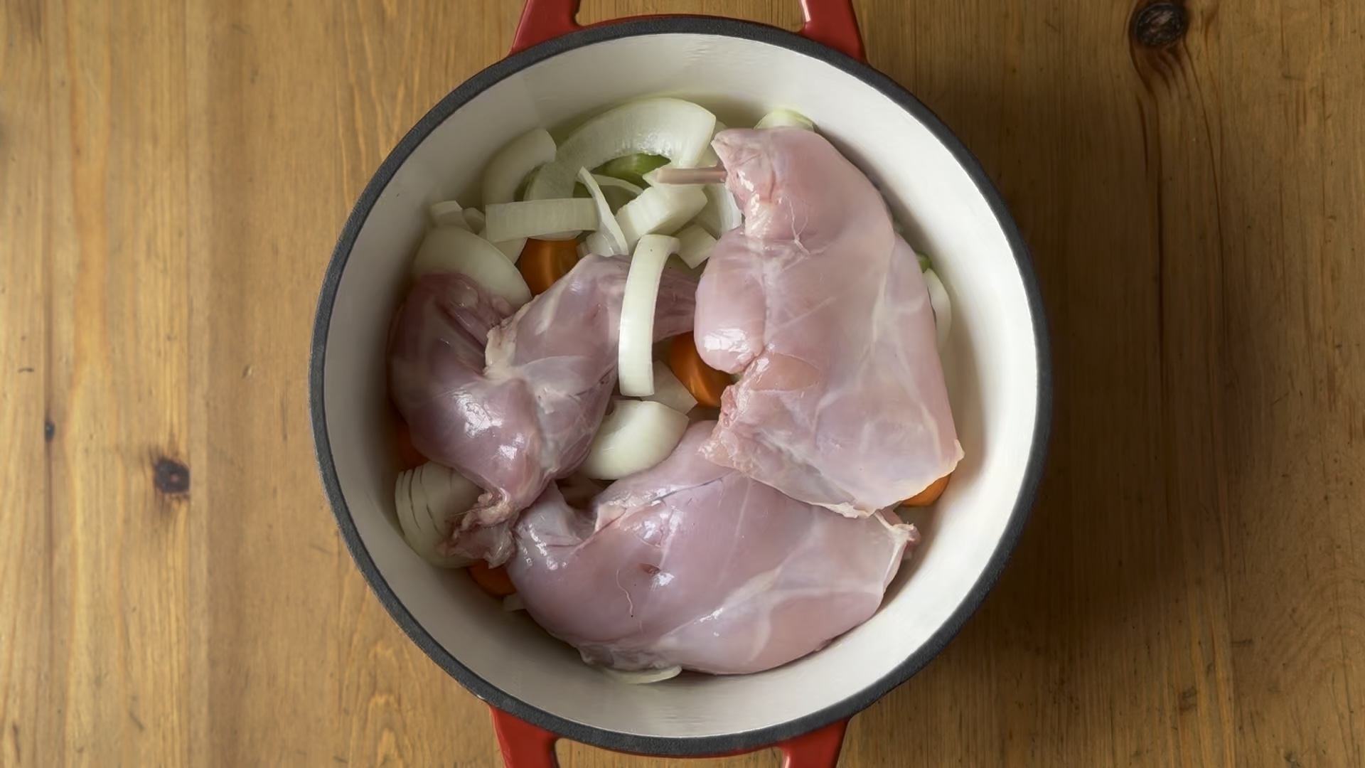 Vegetables in a saucepan with the rabbit