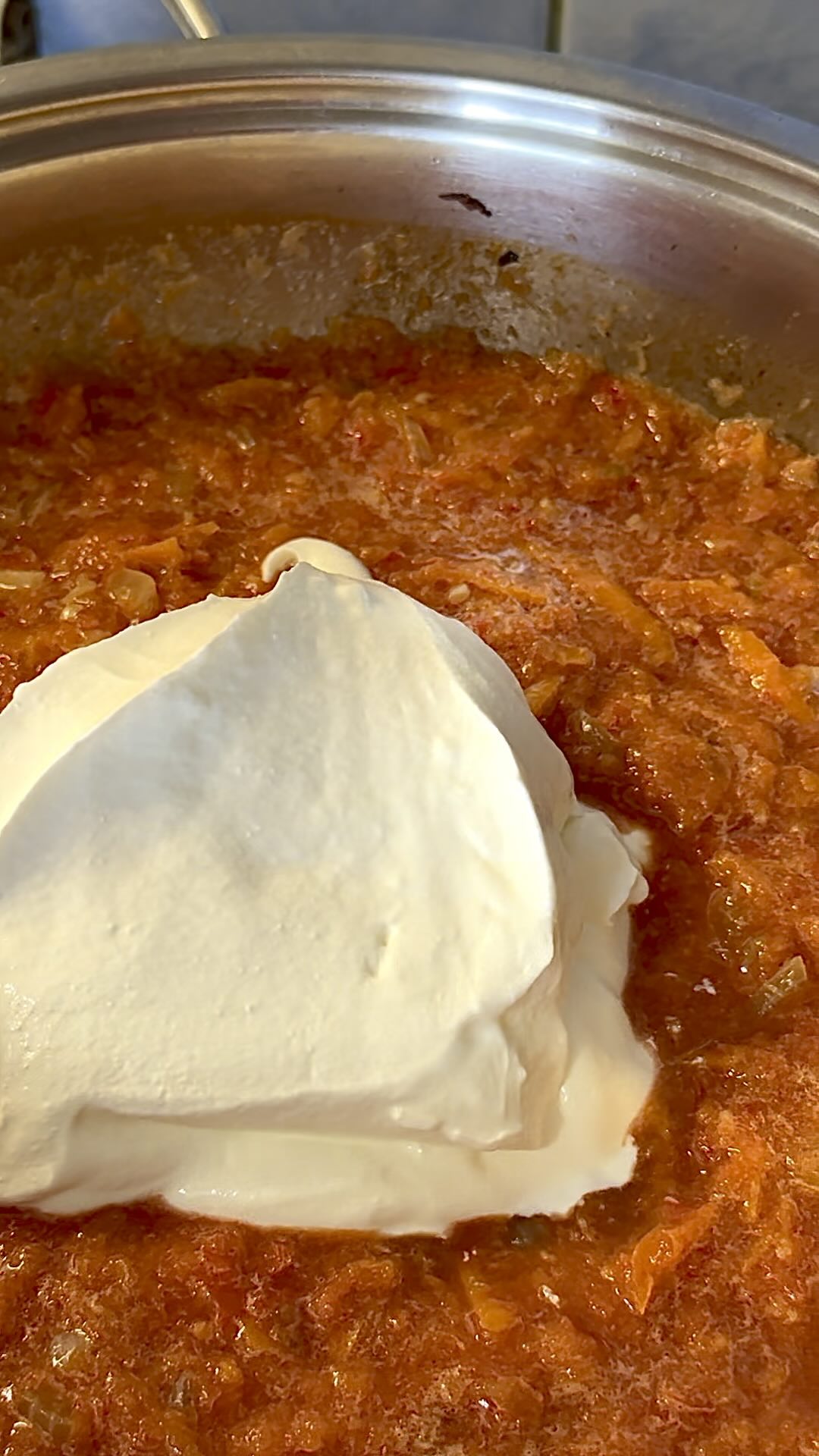 Tomato sauce simmering in a pan